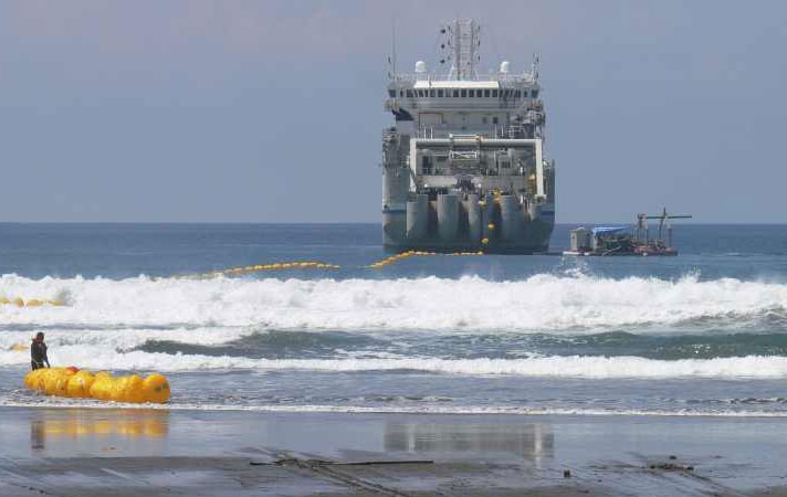 Installing a Cable Shore End - Image by courtesy of Tyco Telecommunications